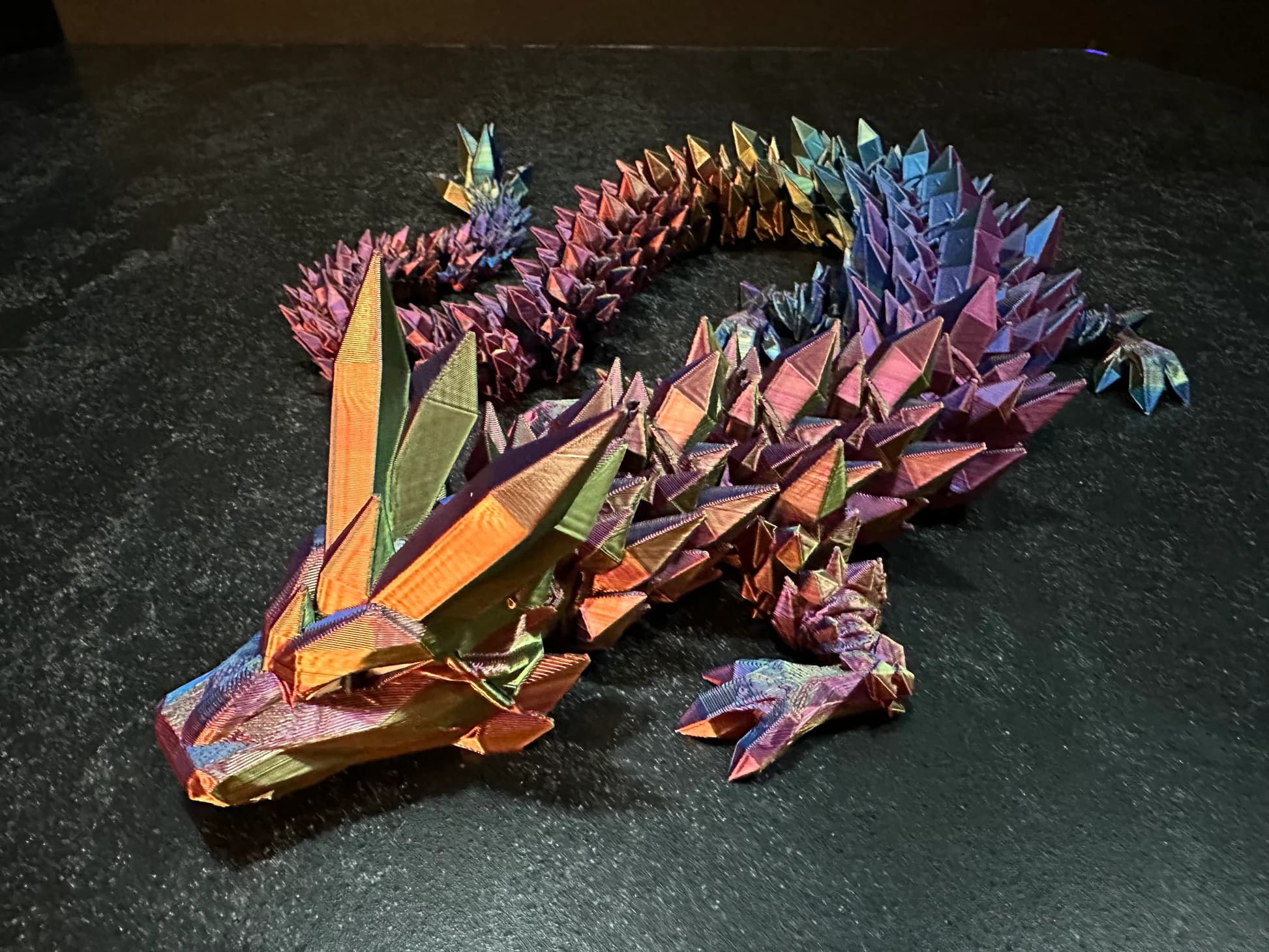 Collection of custom 3D printed dragon figurines and sculptures
